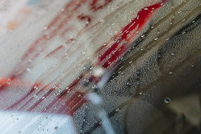 Water droplets on a car window during the celebration.