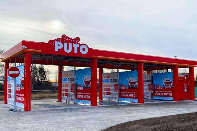 The new PUTO self-service car wash in Tīraine with red and white design.