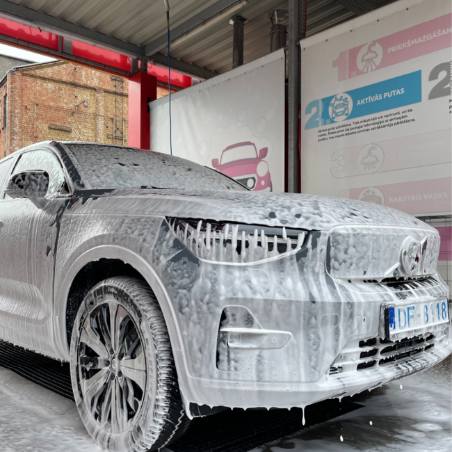 Car with foam in Puto car wash in Riga