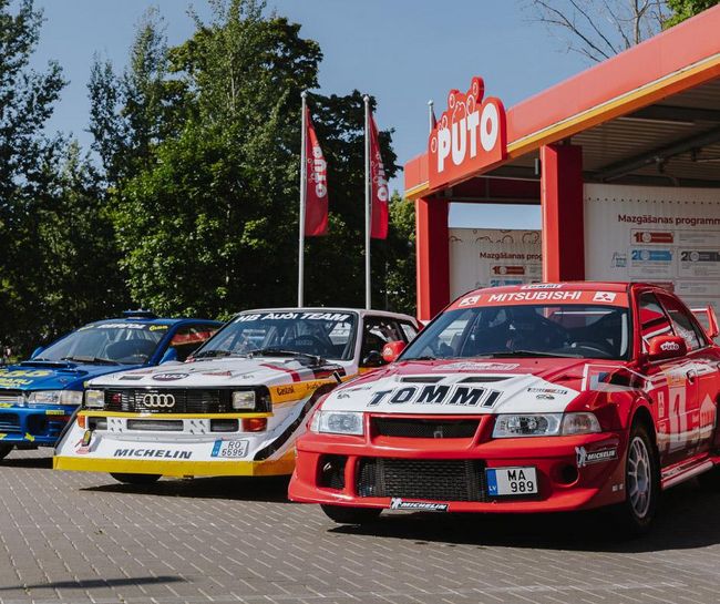 Rally cars parked at PUTO self-service car wash, preparing for Tet Rally Latvia.