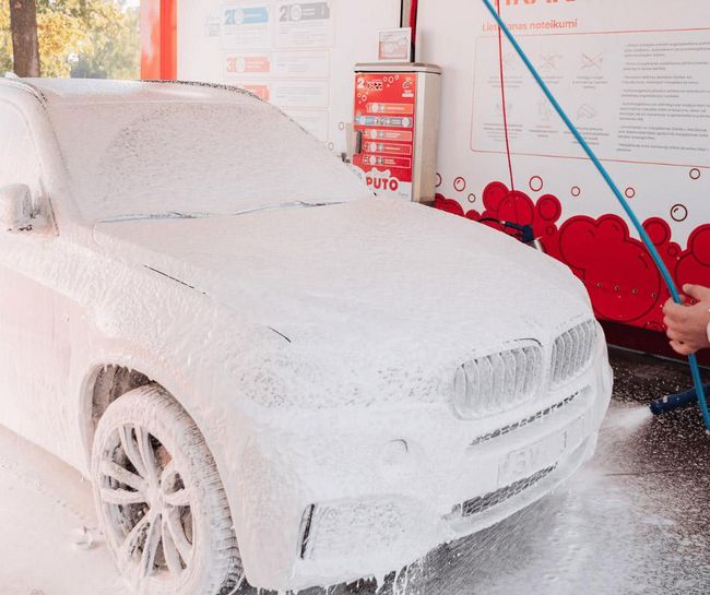 Car covered in foam at PUTO self-service car wash.