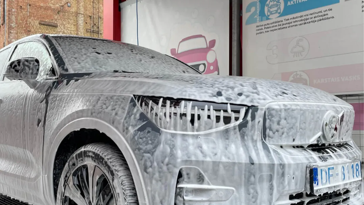 Car with foam in Puto car wash in Riga