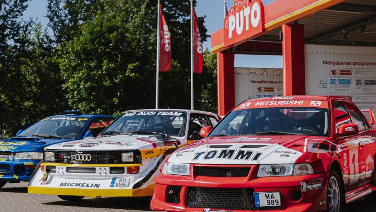 Rally cars parked at PUTO self-service car wash, preparing for Tet Rally Latvia.